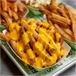  Melted American cheese over crispy fries.
