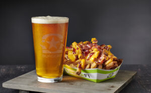 Delicious loaded fries paired with a refreshing beer, highlighting the perfect drinks and snack combination for any occasion