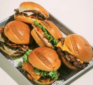 A tray of juicy Burgerfi cheeseburgers. 