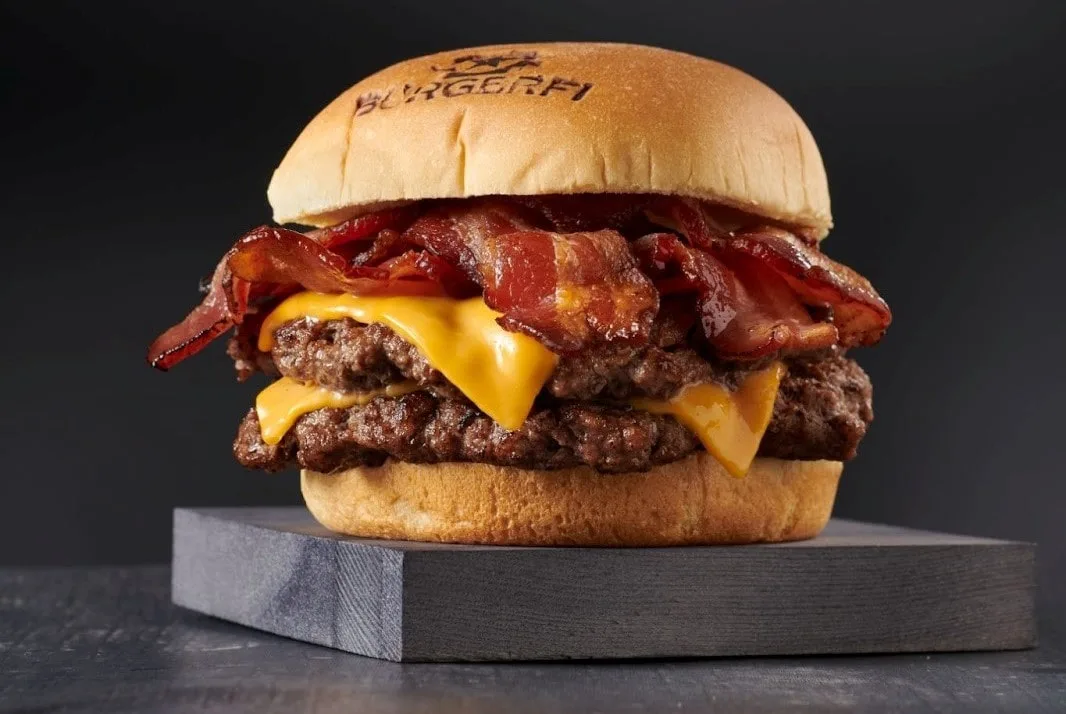 A mouthwatering double cheeseburger piled high with crispy bacon.