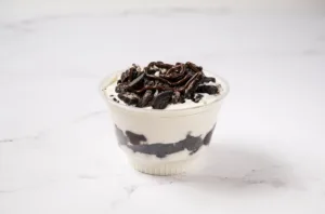  A cup of BurgerFi custard topped with chocolate. 