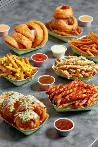 An assortment of dishes from BurgerFi’s chef-led menu